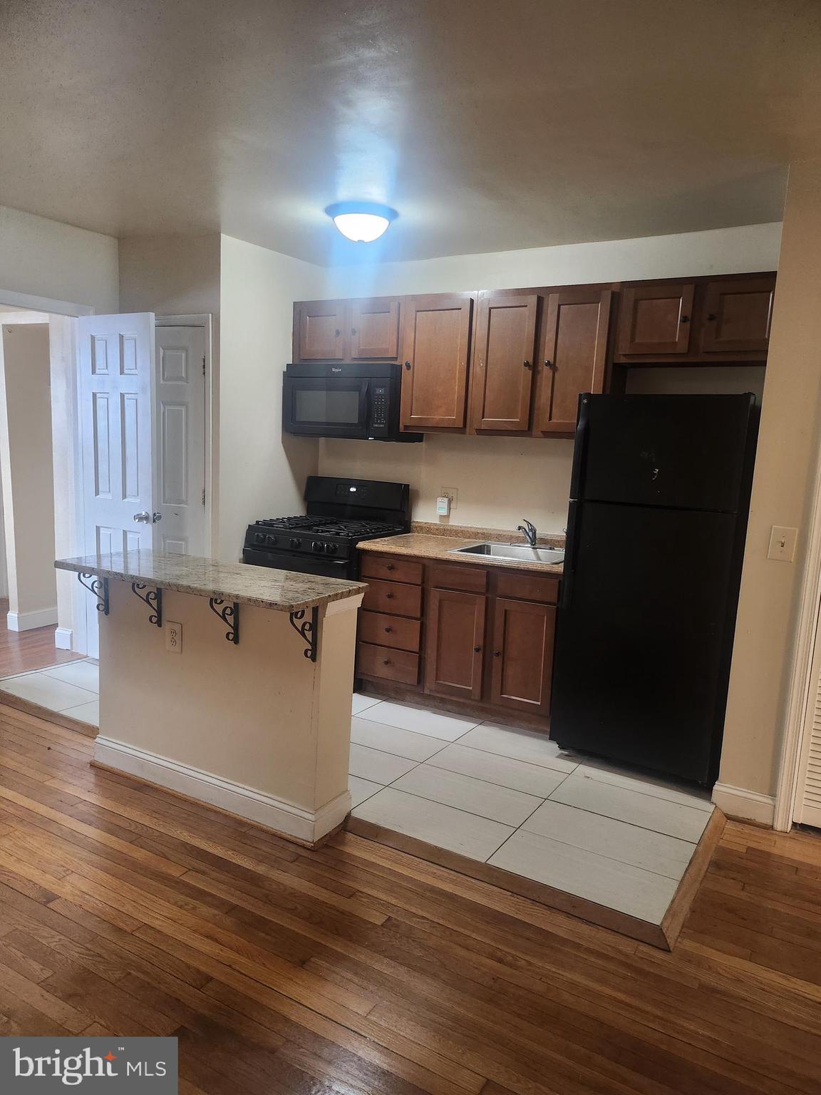 1601 E Street Northeast Washington, DC 20002 - Photo 5 of 10 a kitchen with a sink cabinets and wooden floor