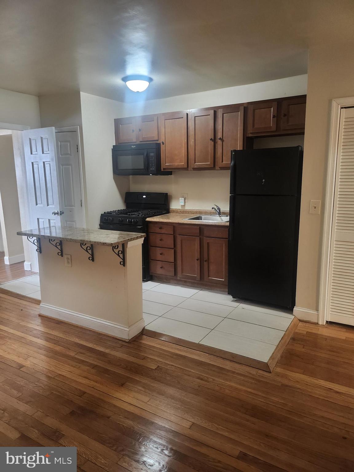 1601 E Street Northeast Washington, DC 20002 - Photo 6 of 10 a kitchen with stainless steel appliances granite countertop a refrigerator and a stove top oven