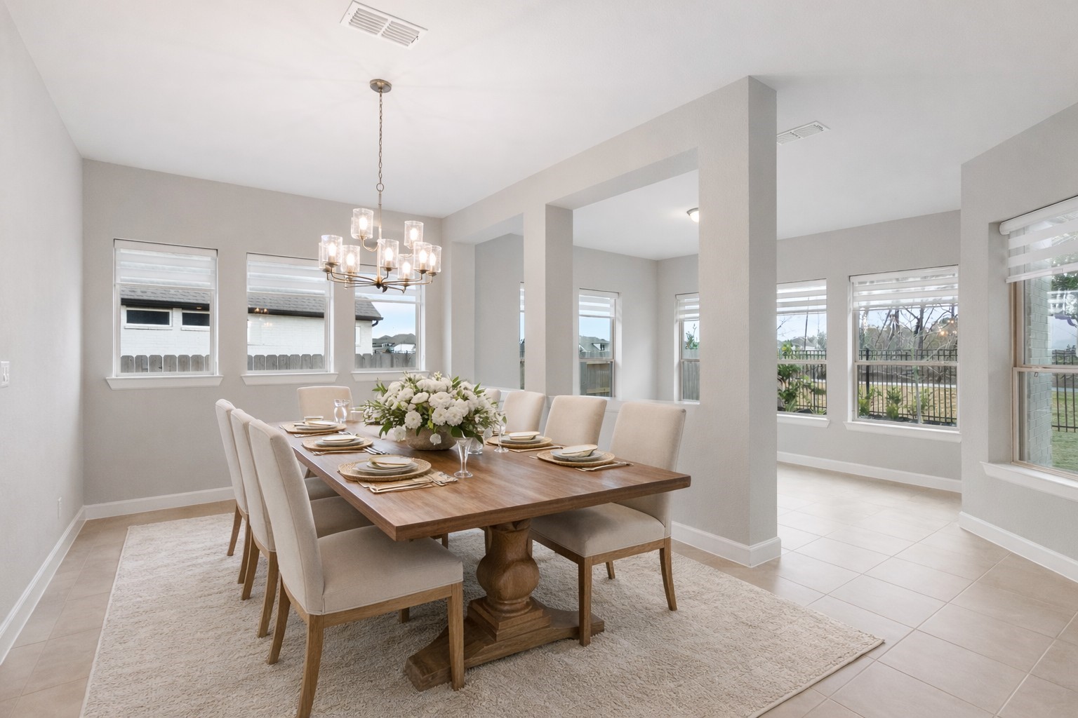 15834 Moran Meadow Street Conroe, TX 77302 - Photo 11 of 41 a dining room with furniture a chandelier and wooden floor