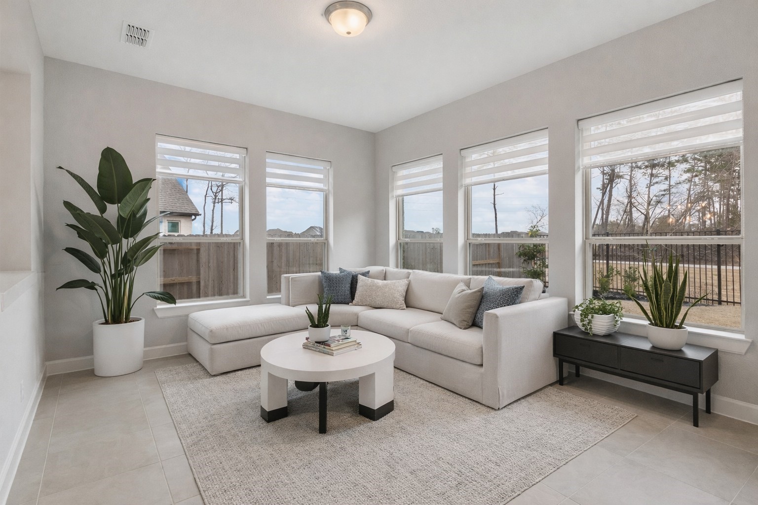 15834 Moran Meadow Street Conroe, TX 77302 - Photo 12 of 41 a living room with furniture and a large window