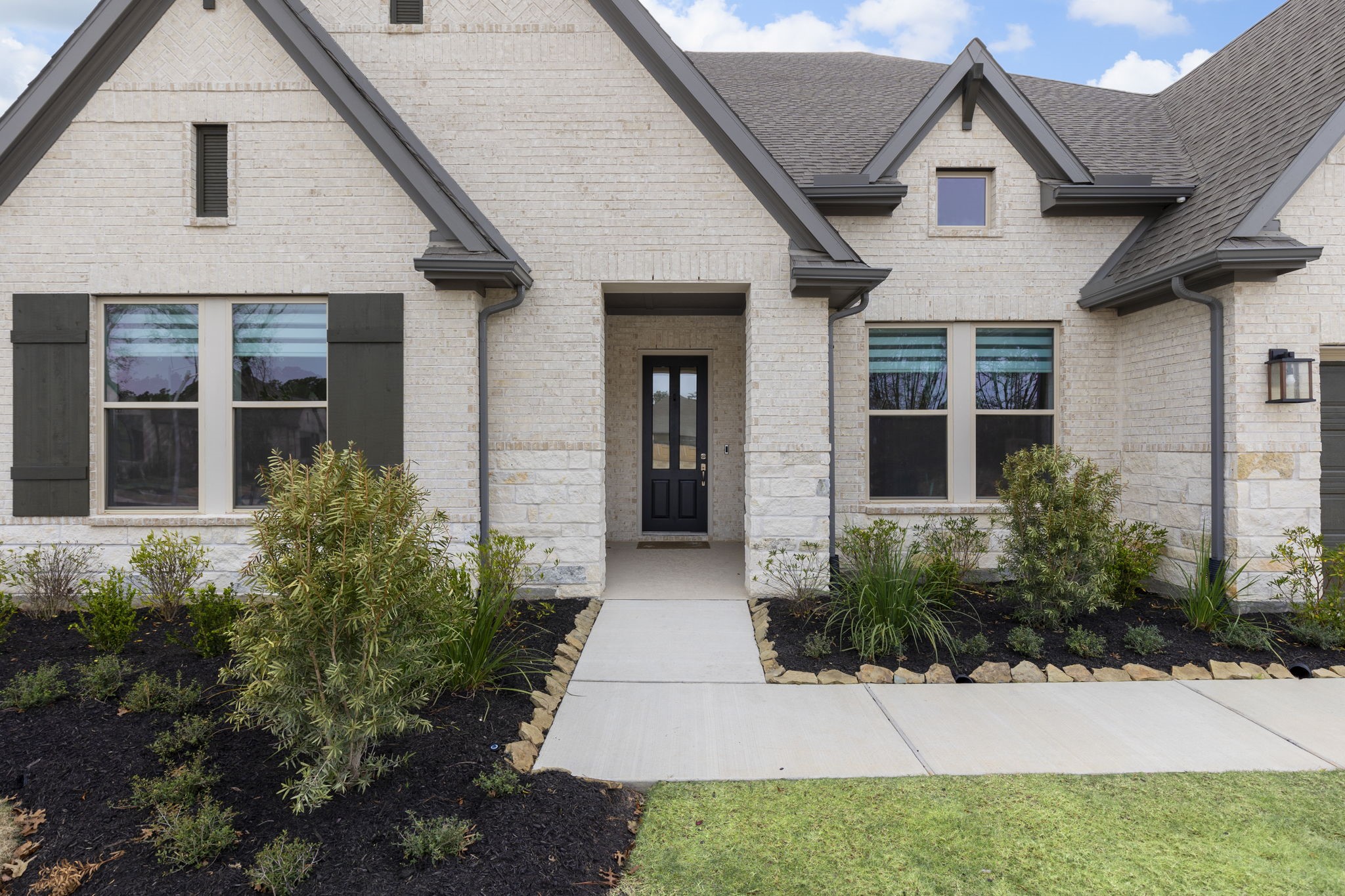 15834 Moran Meadow Street Conroe, TX 77302 - Photo 2 of 41 a view of a house with potted plants