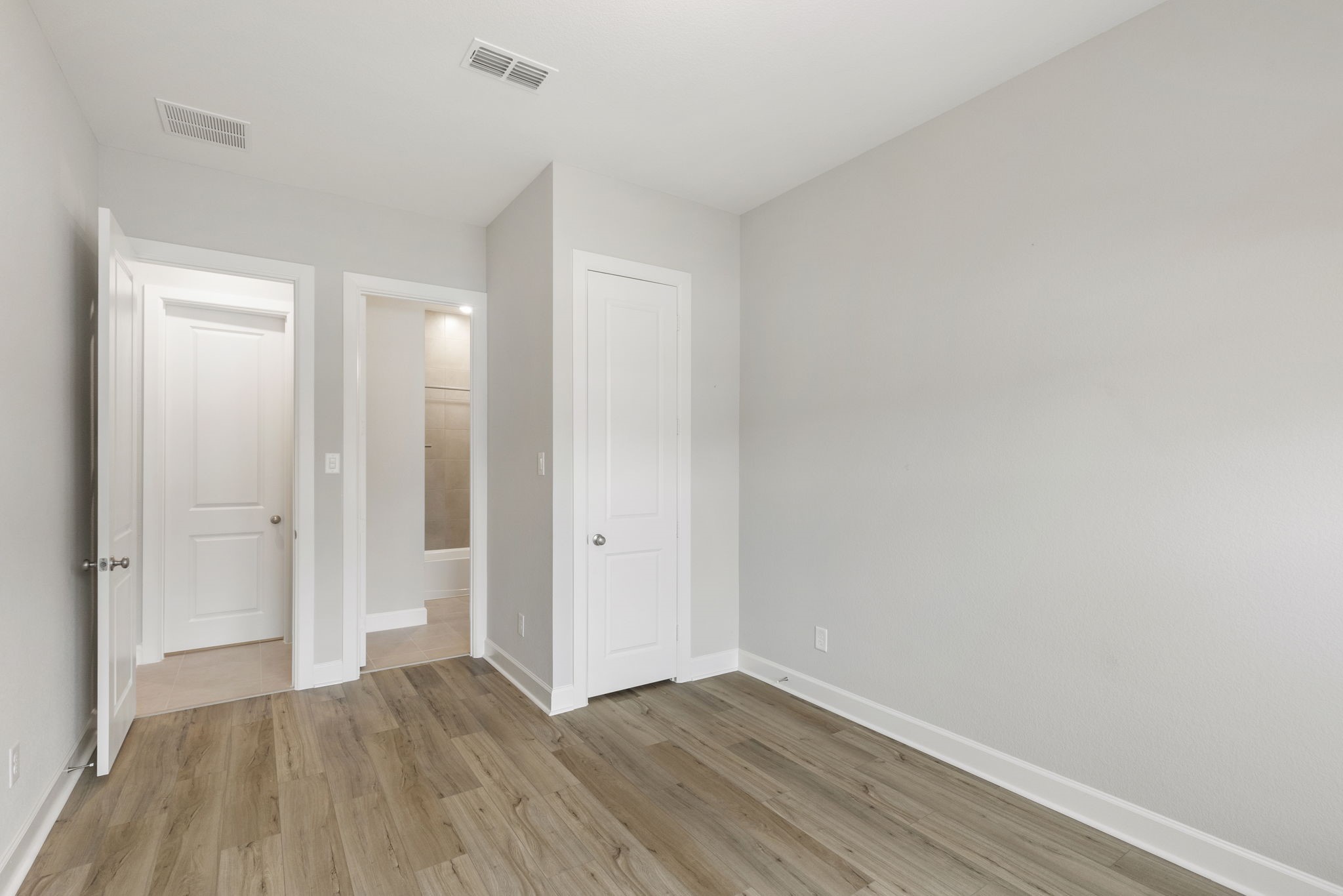 15834 Moran Meadow Street Conroe, TX 77302 - Photo 27 of 41 a view of wooden floor and windows in a room