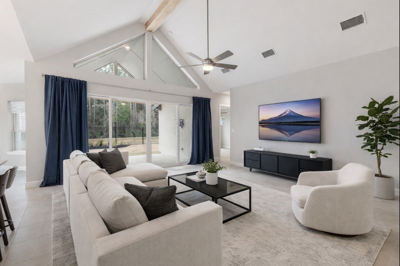 15834 Moran Meadow Street Conroe, TX 77302 - Photo 4 of 41 a living room with furniture and a flat screen tv