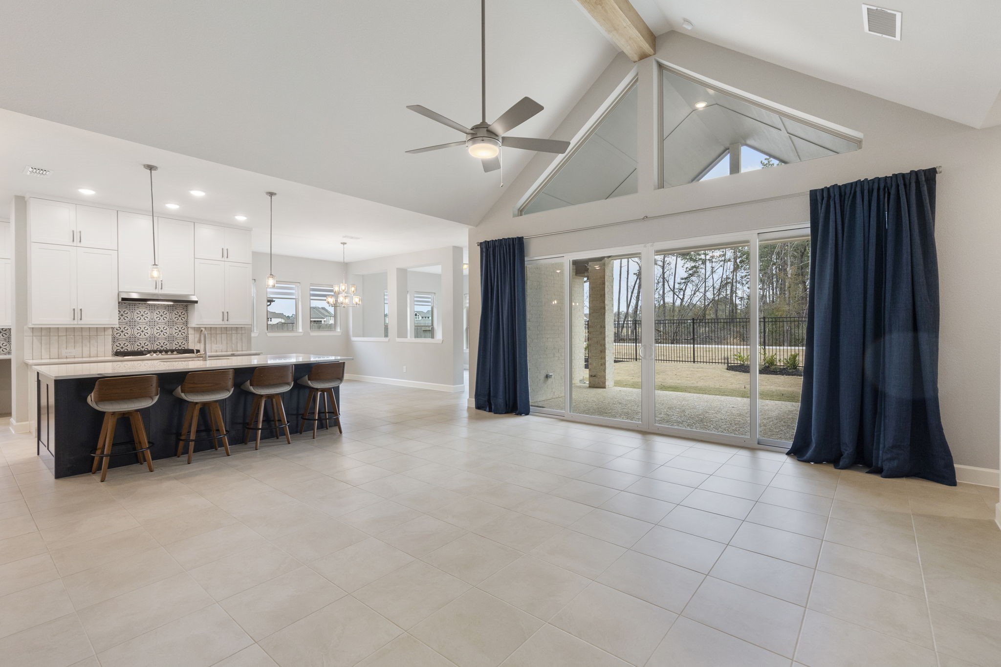 15834 Moran Meadow Street Conroe, TX 77302 - Photo 5 of 41 a large room with a large window and furniture