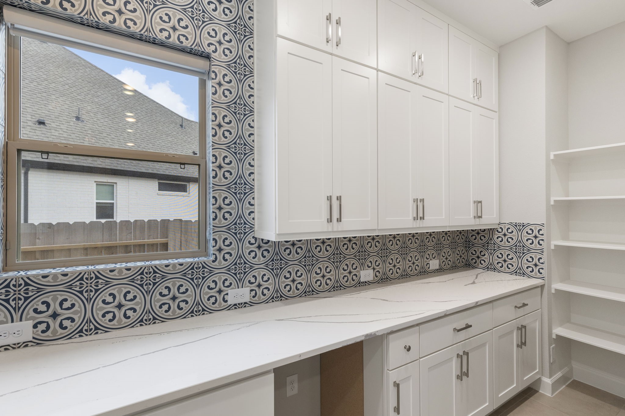 15834 Moran Meadow Street Conroe, TX 77302 - Photo 8 of 41 a view of cabinets with granite countertop white cabinets and a sink