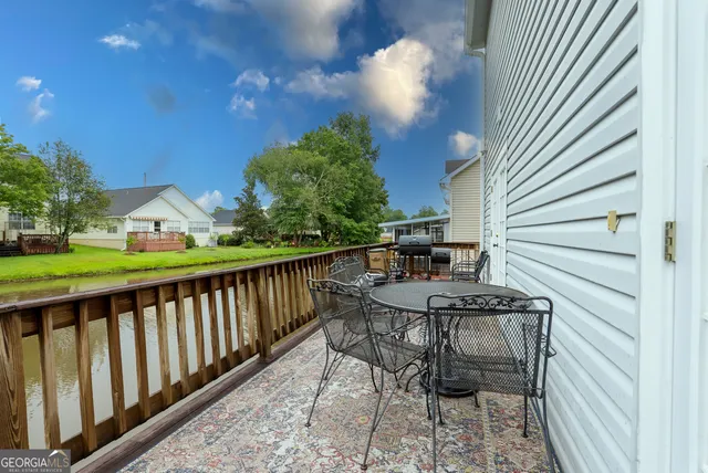 a view of a balcony with furniture