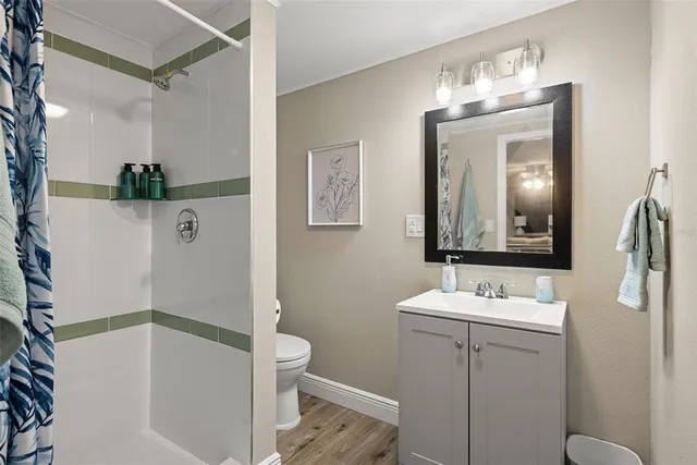 a bathroom with a sink a mirror and a toilet