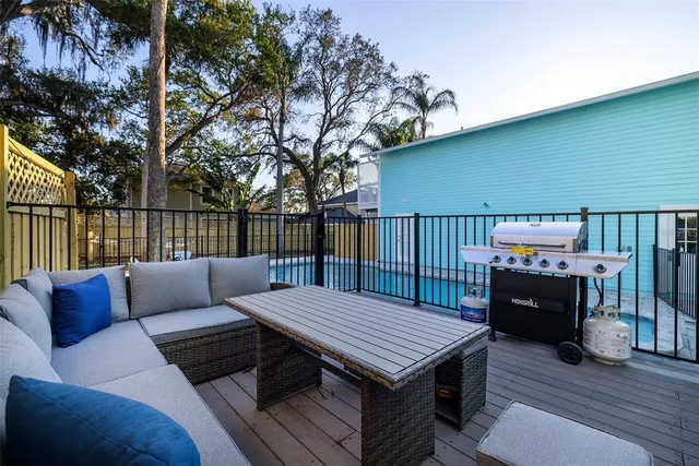 a view of a deck with furniture