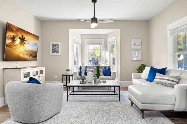 a living room with furniture and a flat screen tv
