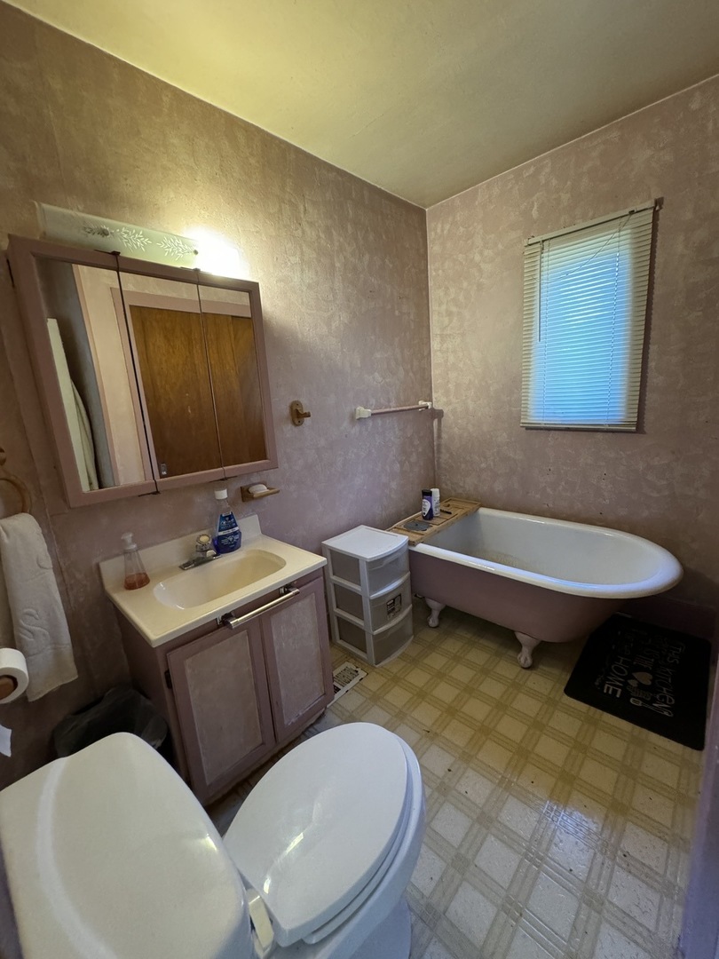 215 Ash Road Kingston, IL 60145 - Photo 5 of 9 a bathroom with a sink a toilet and mirror