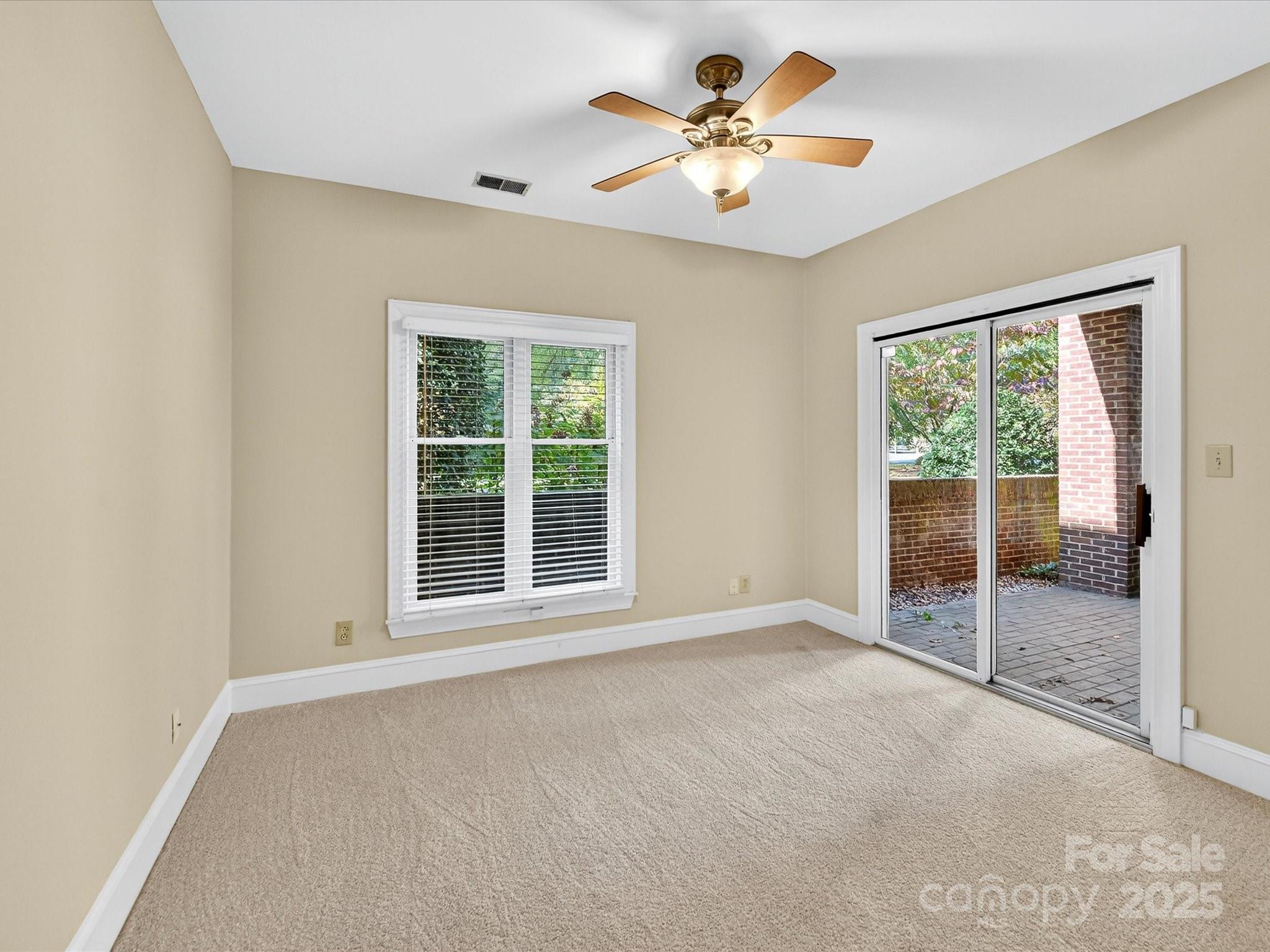 325 Queens Road, Unit 2 Charlotte, NC 28204 - Photo 18 of 25 a view of an empty room with a window