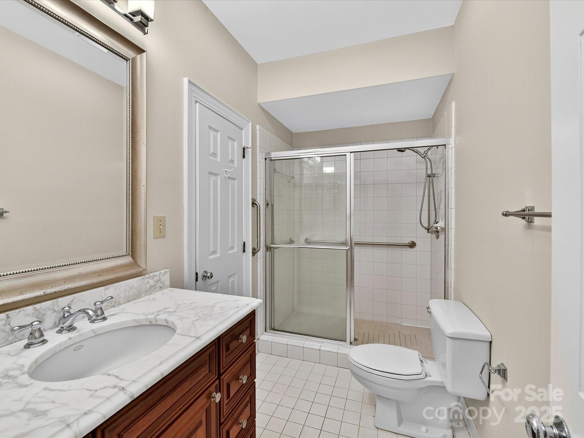 325 Queens Road, Unit 2 Charlotte, NC 28204 - Photo 19 of 25 a bathroom with a sink toilet and shower