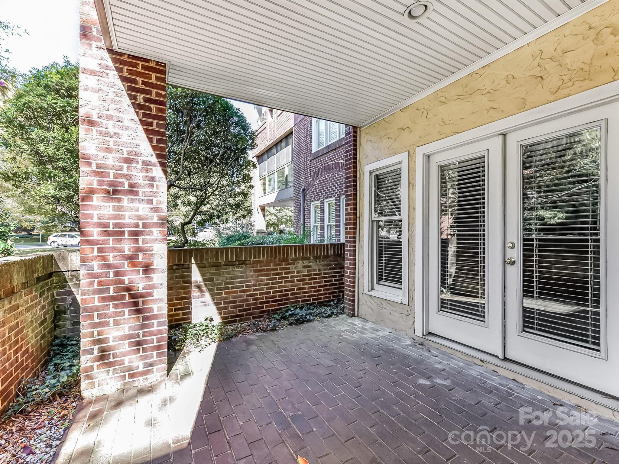 325 Queens Road, Unit 2 Charlotte, NC 28204 - Photo 23 of 25 a front view of a house with a garage
