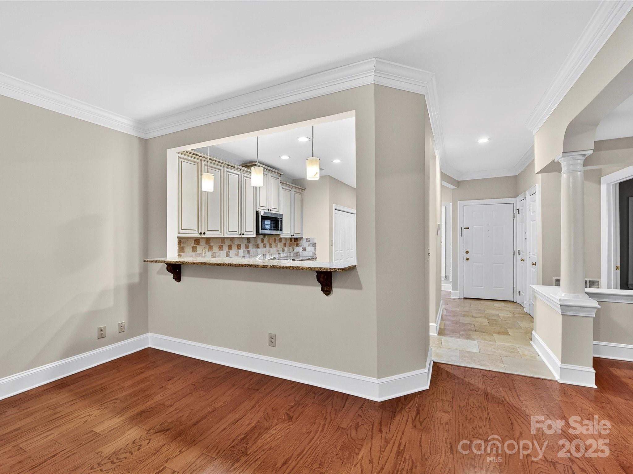 325 Queens Road, Unit 2 Charlotte, NC 28204 - Photo 6 of 25 a view of a kitchen cabinets and wooden floor