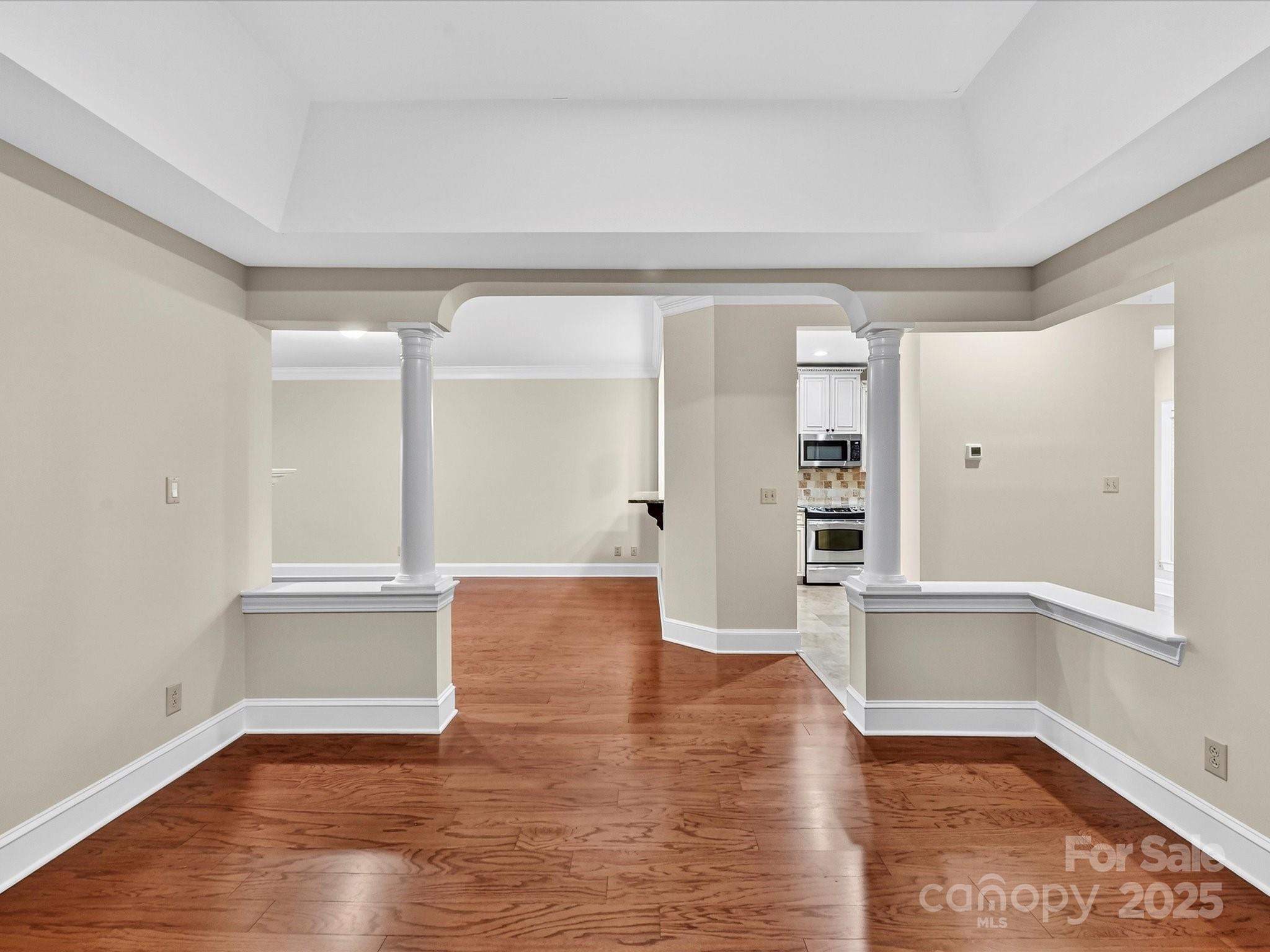 325 Queens Road, Unit 2 Charlotte, NC 28204 - Photo 10 of 25 wooden floor in an empty room with a window