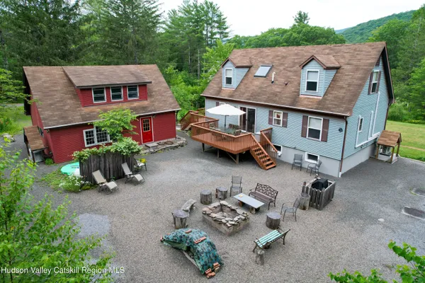 a aerial view of a house with swimming pool and garden