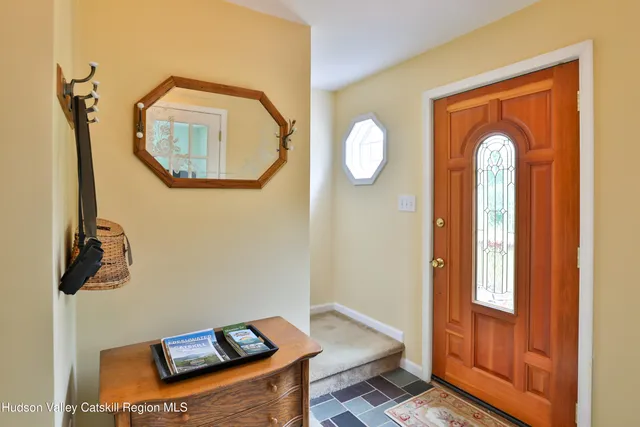 a front view of a house with wooden floor mirror