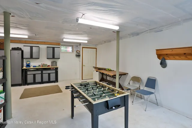 a kitchen with a table and chairs