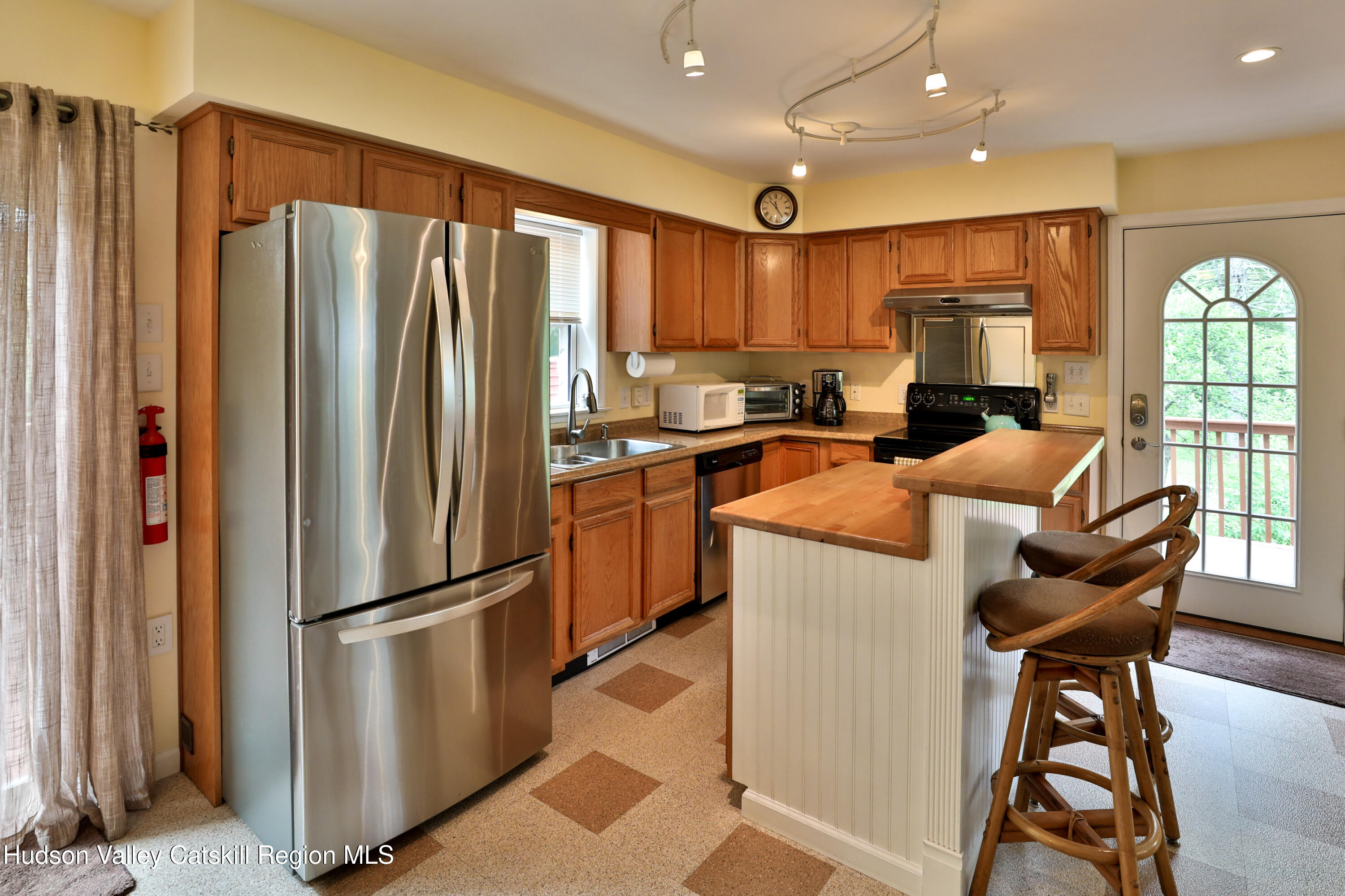 68 Garfield Road Phoenicia, NY 12464 - Photo 2 of 43 a kitchen with stainless steel appliances granite countertop a refrigerator stove microwave and sink