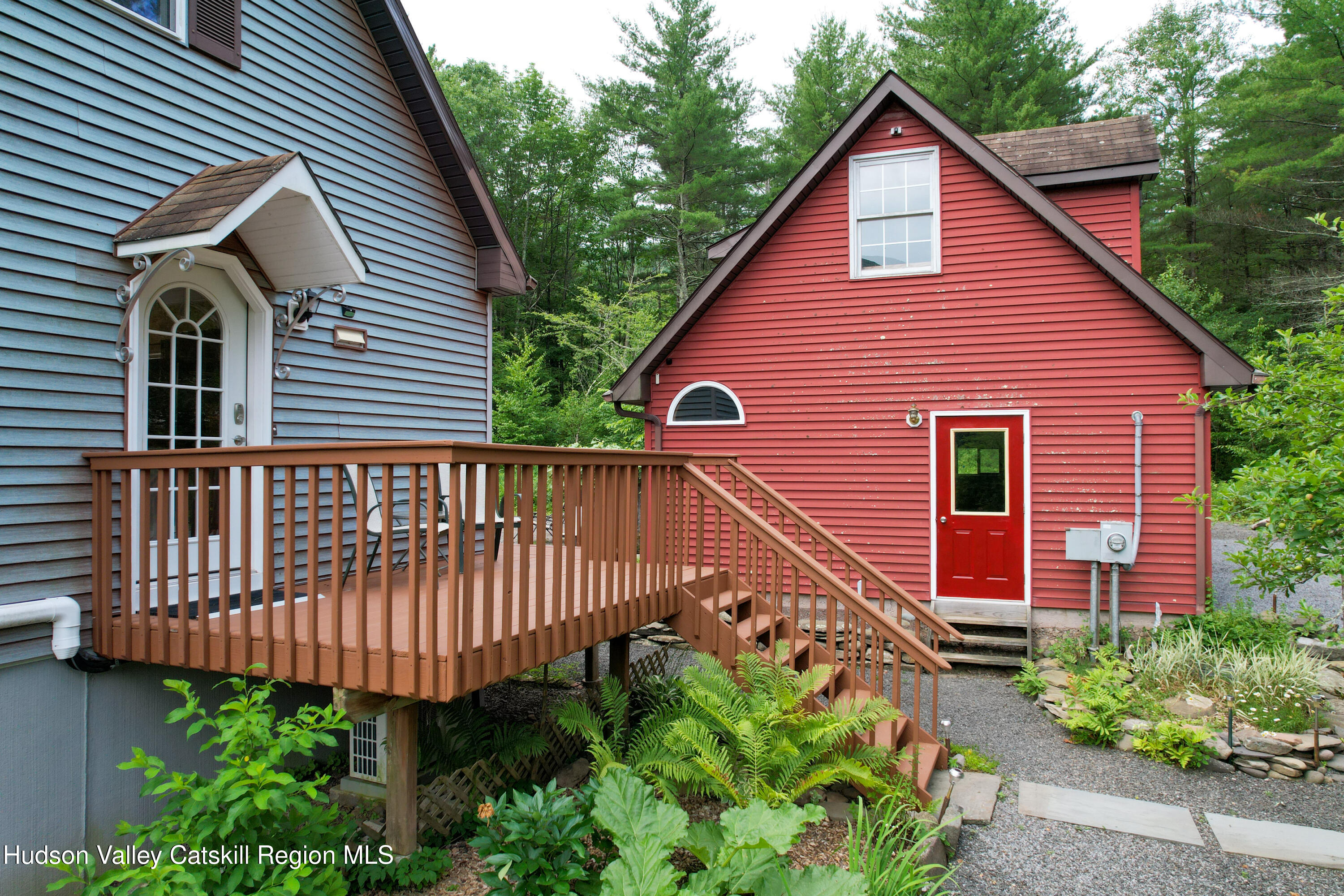 68 Garfield Road Phoenicia, NY 12464 - Photo 29 of 43 a view of a house with brick walls and flower garden