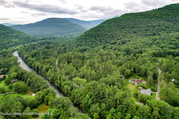 an aerial view of a house with lots of trees