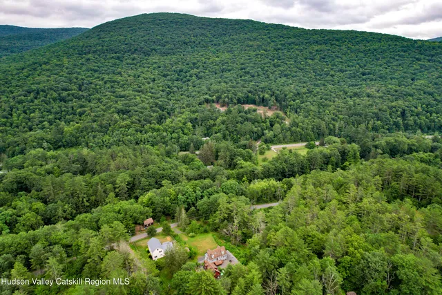 a front view of a house with a yard table and chairs