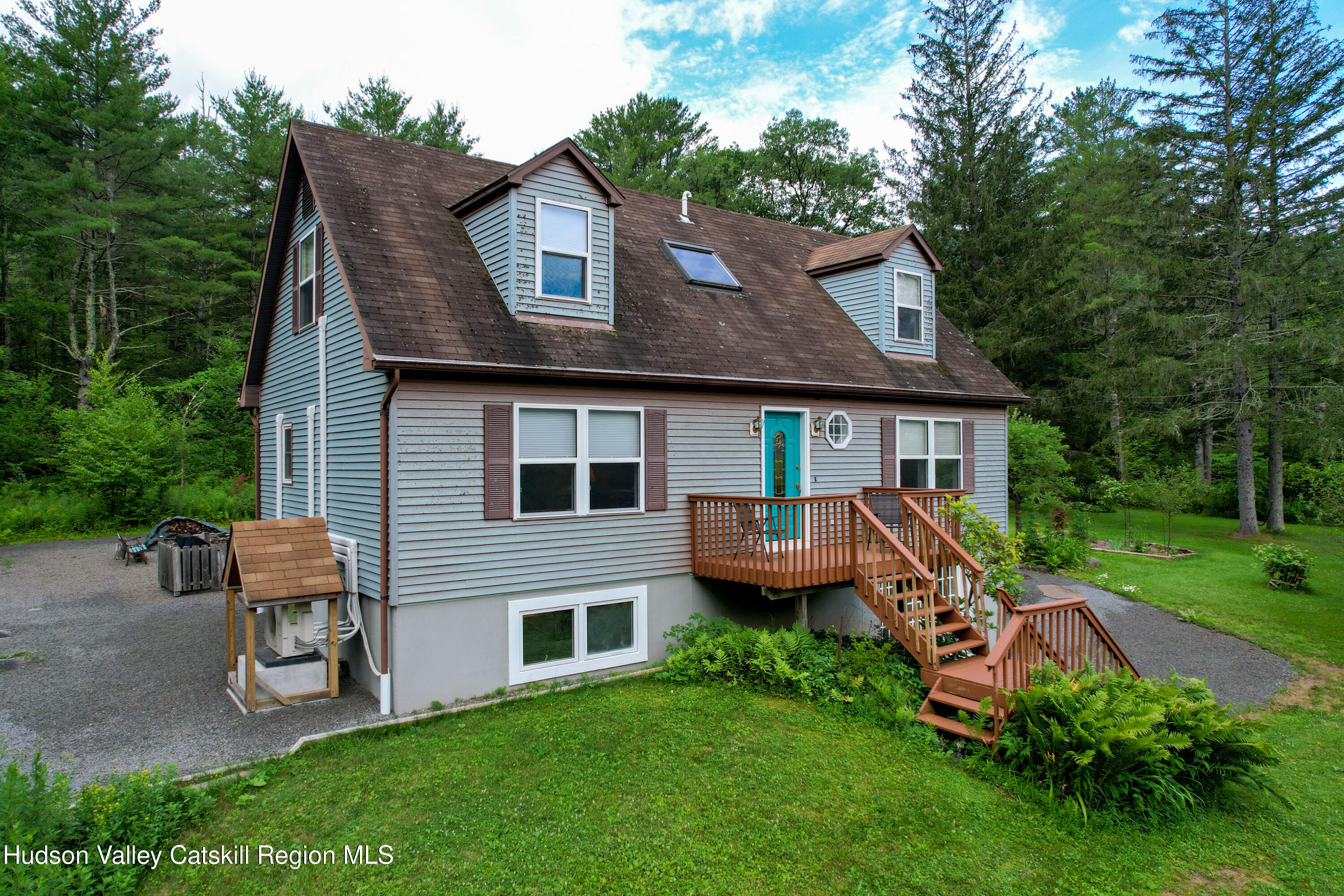 68 Garfield Road Phoenicia, NY 12464 - Photo 38 of 43 a front view of a house with a yard table and chairs