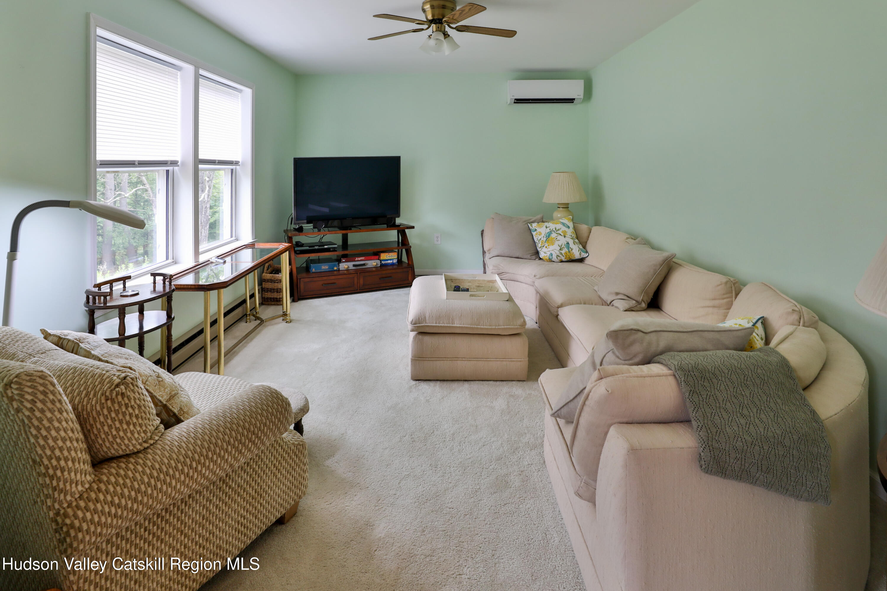 68 Garfield Road Phoenicia, NY 12464 - Photo 4 of 43 a living room with furniture and a flat screen tv