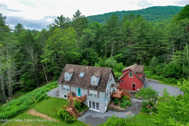 an aerial view of a house with big yard