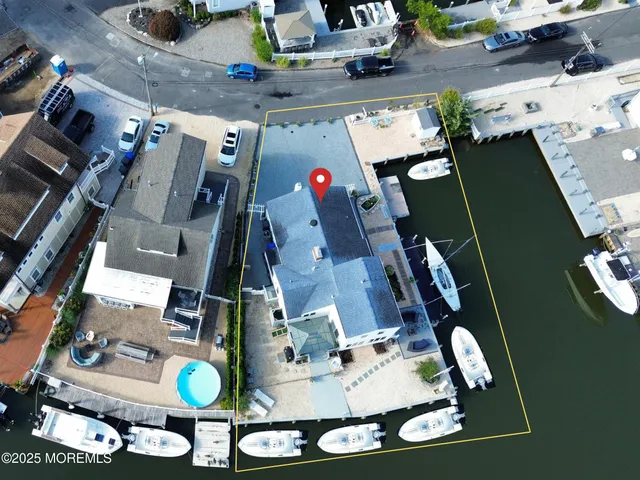 an aerial view of house with a yard