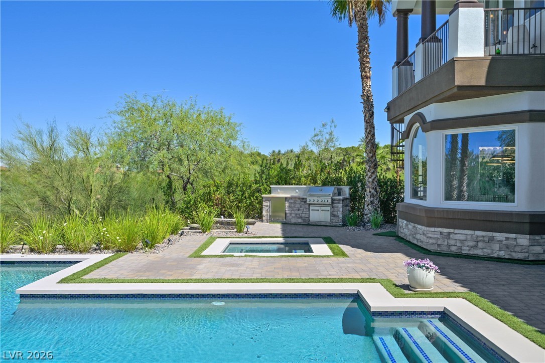6 Rue Du Ville Henderson, NV 89011 - Photo 77 of 99 Enjoy outdoor living with this refreshing pool, spa, and barbecue area.