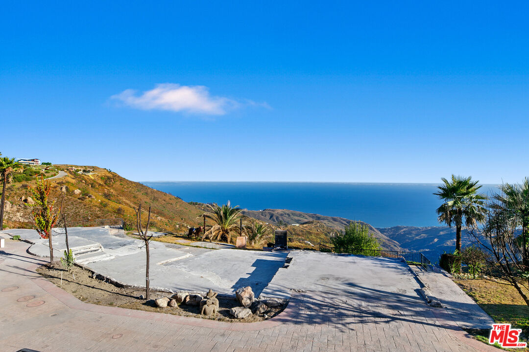 23010 Saddle Peak Road Topanga, CA 90290 - Photo 4 of 51 a view of a ocean with a nearby beach