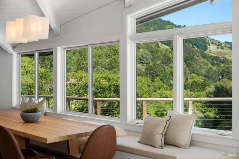a view of bedroom with a bed and wooden floor