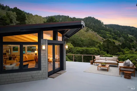 a bedroom with a bed and a potted plant