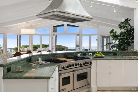 a bathroom with a sink vanity and mirror