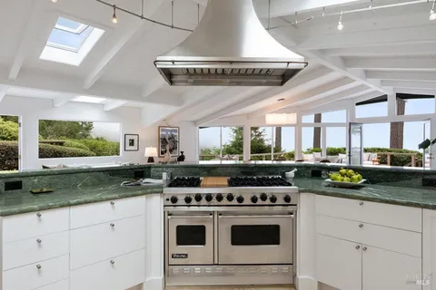 a bedroom with furniture and wooden floor