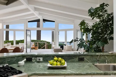 a bathroom with a shower curtain a toilet and a sink