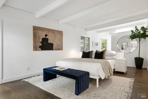 a bathroom with a sink vanity granite tub and shower