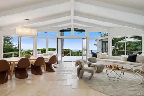 a kitchen with a stove a sink and cabinets