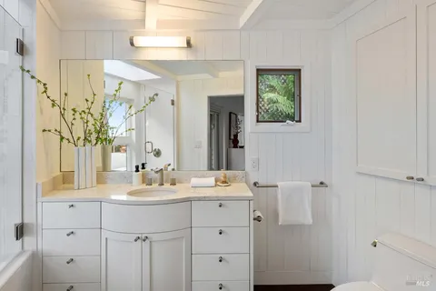 an aerial view of a house with swimming pool patio and outdoor seating