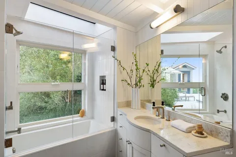 an aerial view of a house with swimming pool garden and patio