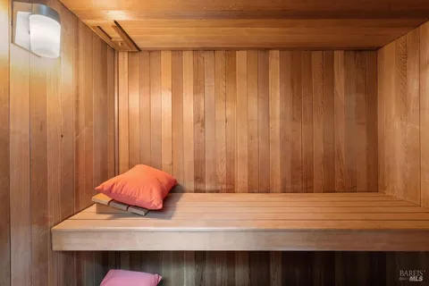 aerial view of a house with large trees and plants