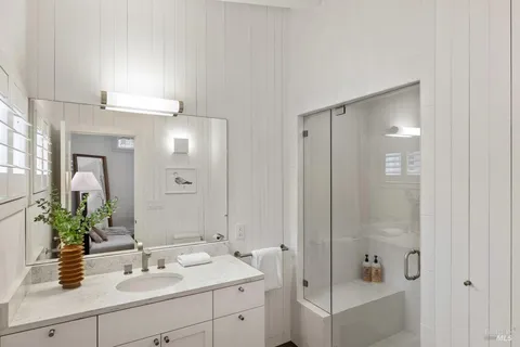 swimming pool view with a seating space