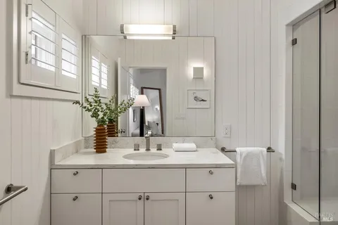 an aerial view of a house with outdoor space