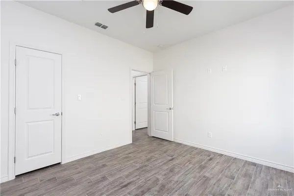 an empty room with wooden floor