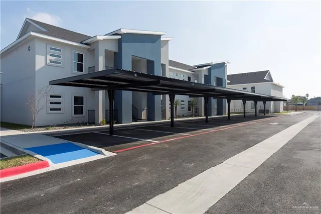 a front view of building with yard