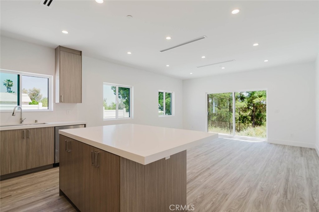 17846 Rinaldi Street Granada Hills, CA 91344 - Photo 9 of 34 a kitchen with a sink and large window