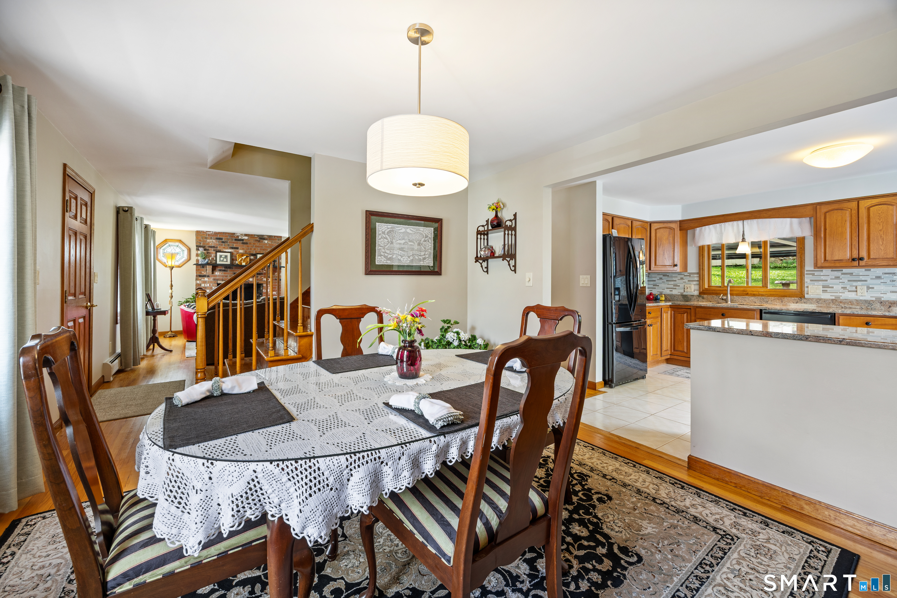 42 Chimney Sweep Road Wallingford, CT 06492 - Photo 14 of 40 a dining room filled chandelier and wooden floor