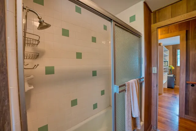 a bathroom with a bathtub and a shower