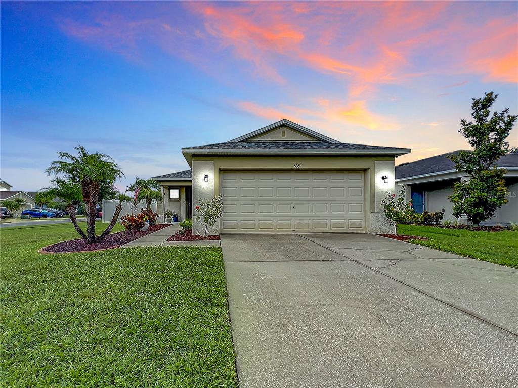 539 19th Street Northwest Ruskin, FL 33570 - Photo 1 of 1 a front view of a house with garden